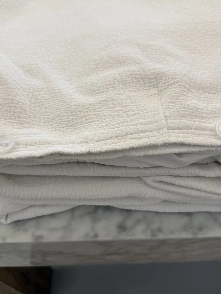 Stack of freshly laundered white cotton linen